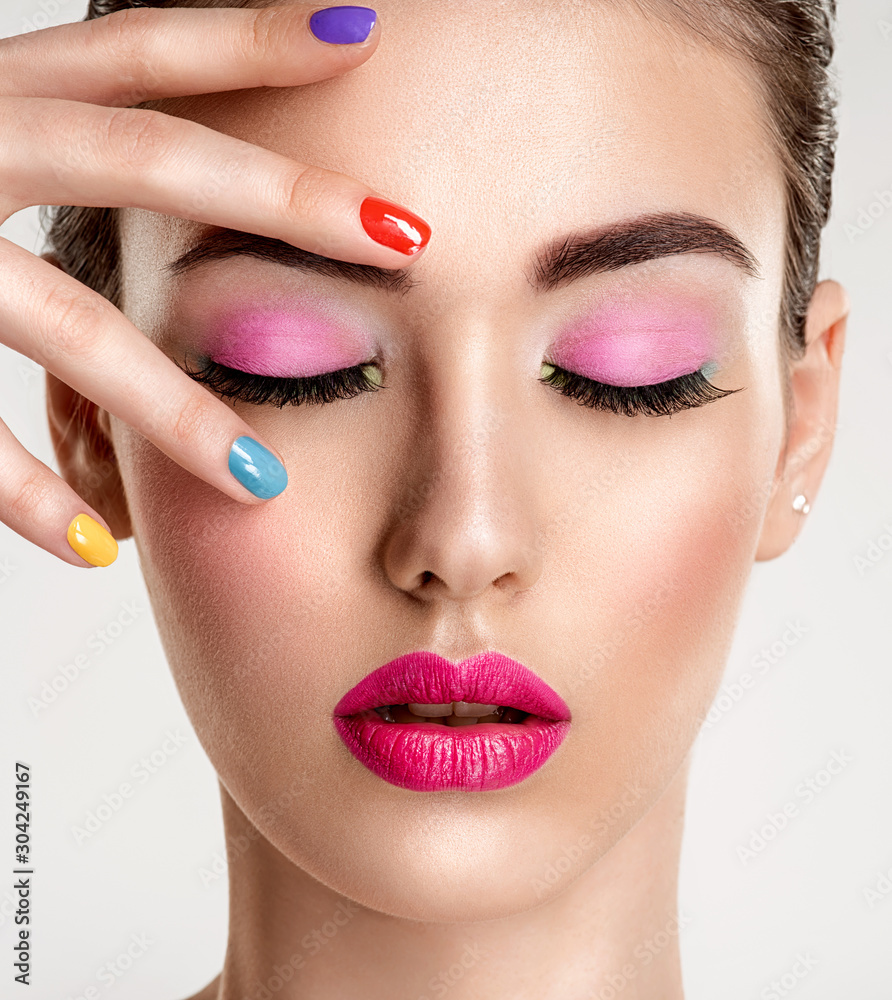 Naklejka premium Beautiful fashion woman with a colored nails. Attractive white girl with multicolor manicure.