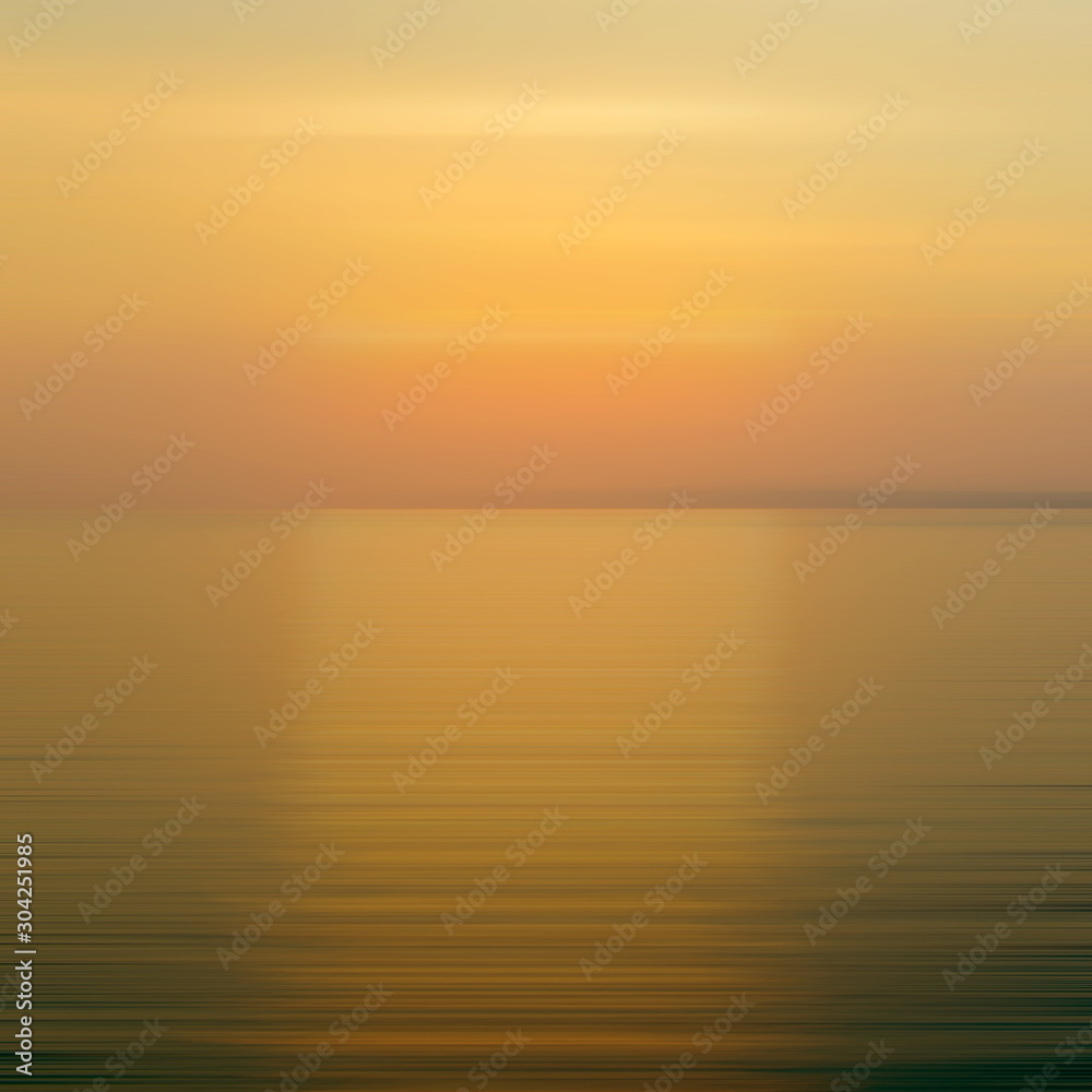 Abstract orange background motion blur sunset on the sea