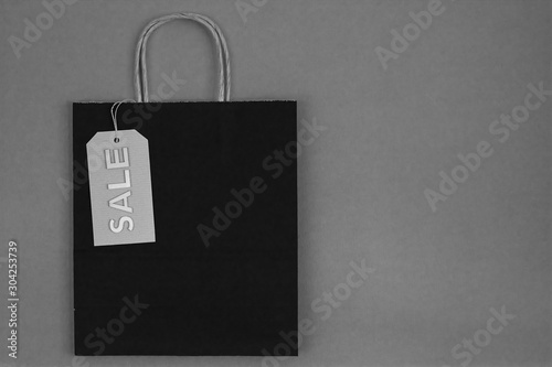 black and white paper bag with sale tag
