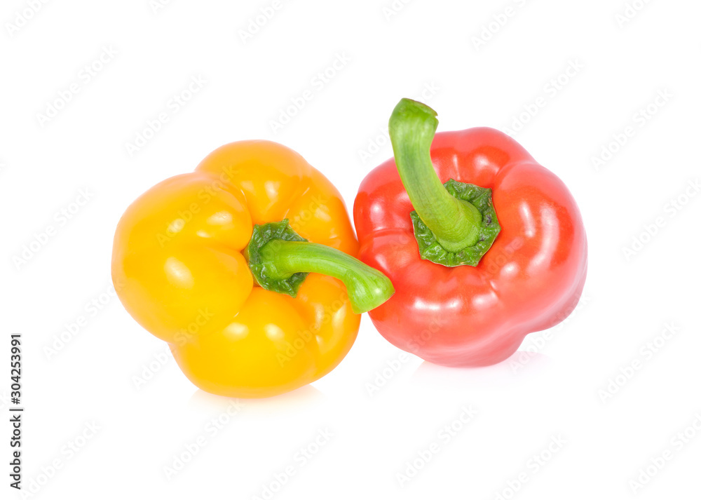 whole fresh red and yellow bell pepper with stem on white background whole fresh red and yellow bell pepper with stem on white background