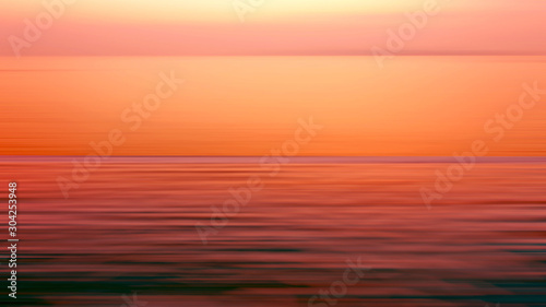 Motion blurred background of refraction in the sea