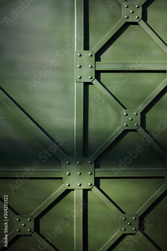 Military green industrial metal plate with rivets. Background .Metal texture