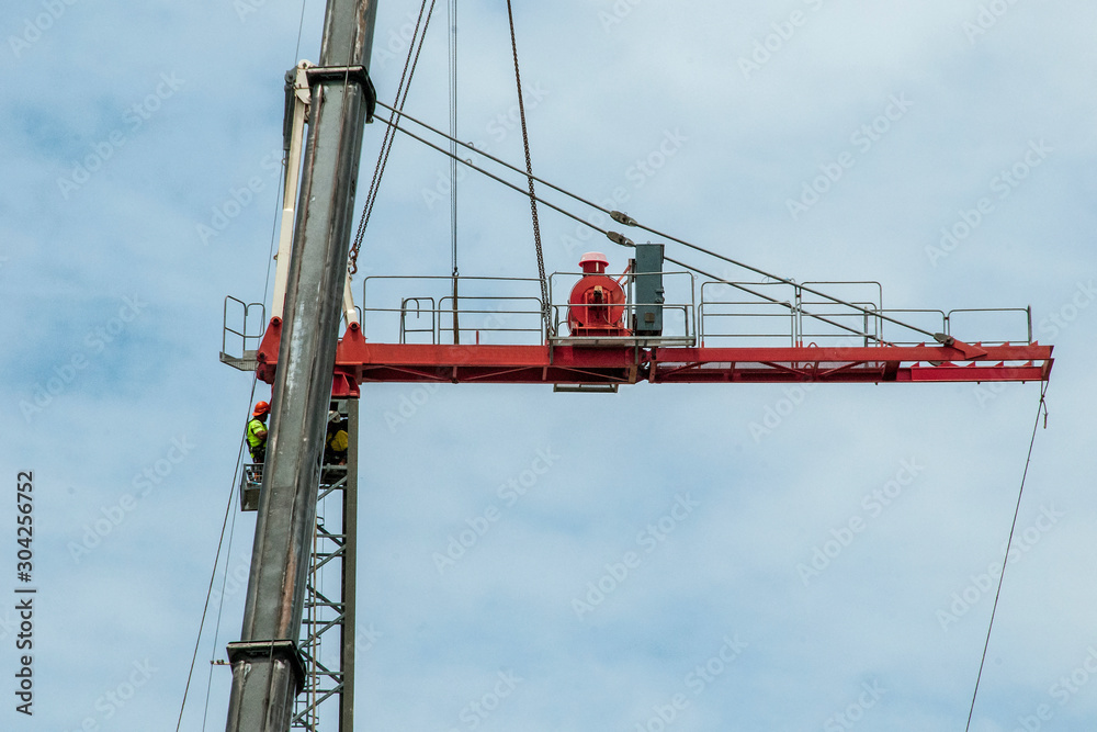 A Construction Sky Crane being removed from a new high rise multistory building site. Australia A Construction Sky Crane being removed from a new high rise multistory building site. Australia