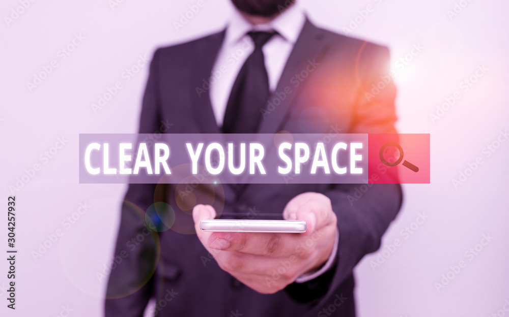 Word writing text Clear Your Space. Business photo showcasing Clean office studio area Make it empty Refresh Reorganize Male human wear formal work suit hold smart hi tech smartphone use one hand Word writing text Clear Your Space. Business photo showcasing Clean office studio area Make it empty Refresh Reorganize Male human wear formal work suit hold smart hi tech smartphone use one hand