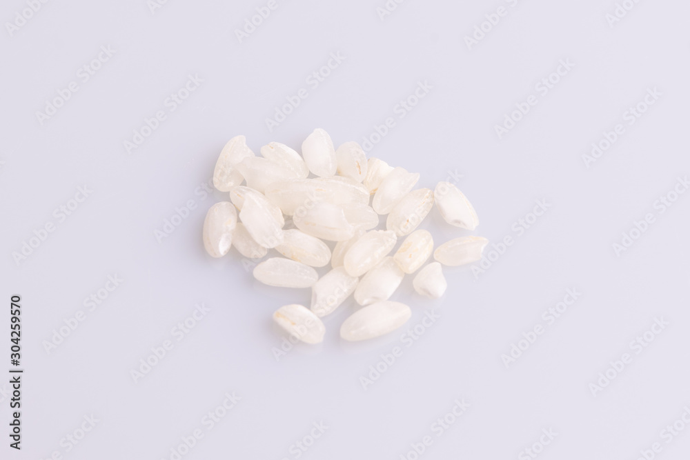 Italian Risotto rice on white background. Copy Space. Soft light. Latin term Italian Risotto rice on white background. Copy Space. Soft light. Latin term