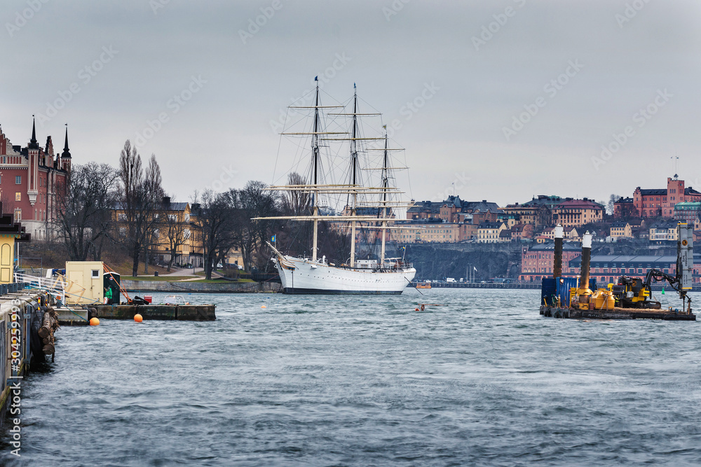 Ship with three masts on the water Ship with three masts on the water