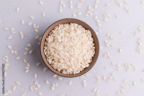 Italian Risotto rice on white background. Copy Space. Soft light. Latin term 