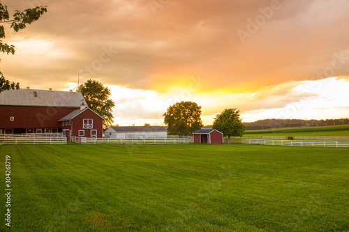 Typical Amish farm at sunset seen from Pennsylvania Dutch area photo