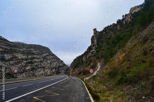 countryside road on the mountain in spain pyrenees valley in winter