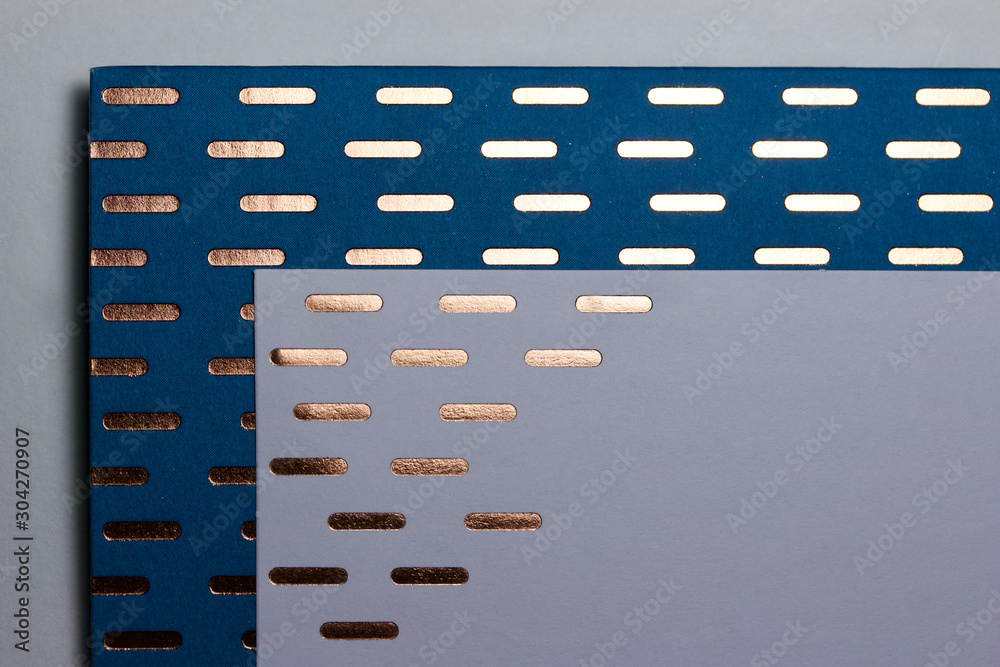 Decorative blue paper texture background with rounded gold color line designs Decorative blue paper texture background with rounded gold color line designs