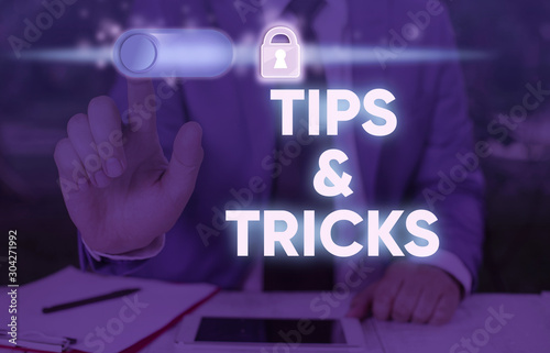 Writing note showing Tips And Tricks. Business concept for Steps Lifehacks Handy advice Recommendations Skills photo