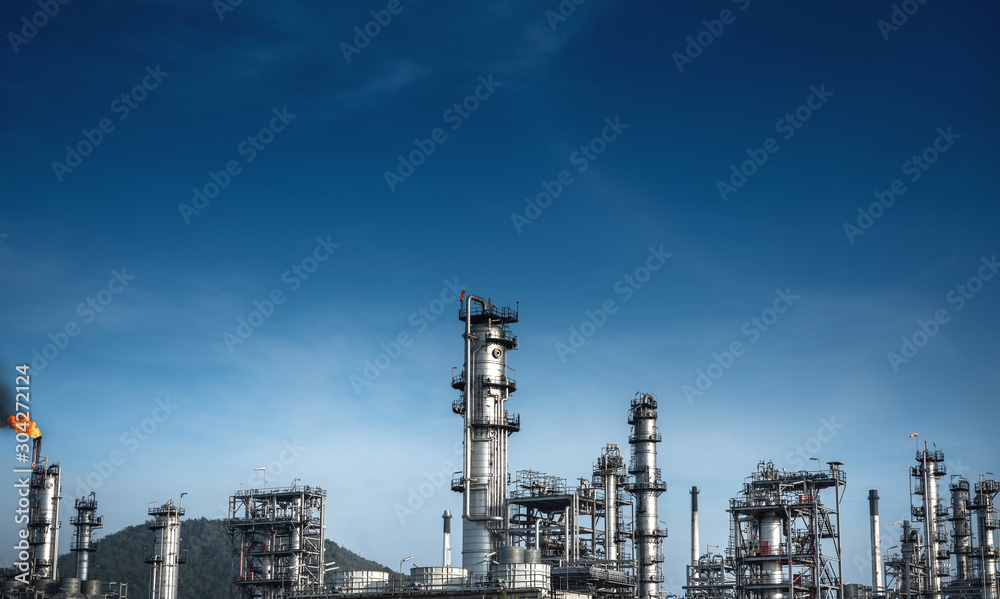 Close up Industrial view at oil refinery plant form industry zone with sunrise and cloudy sky Close up Industrial view at oil refinery plant form industry zone with sunrise and cloudy sky
