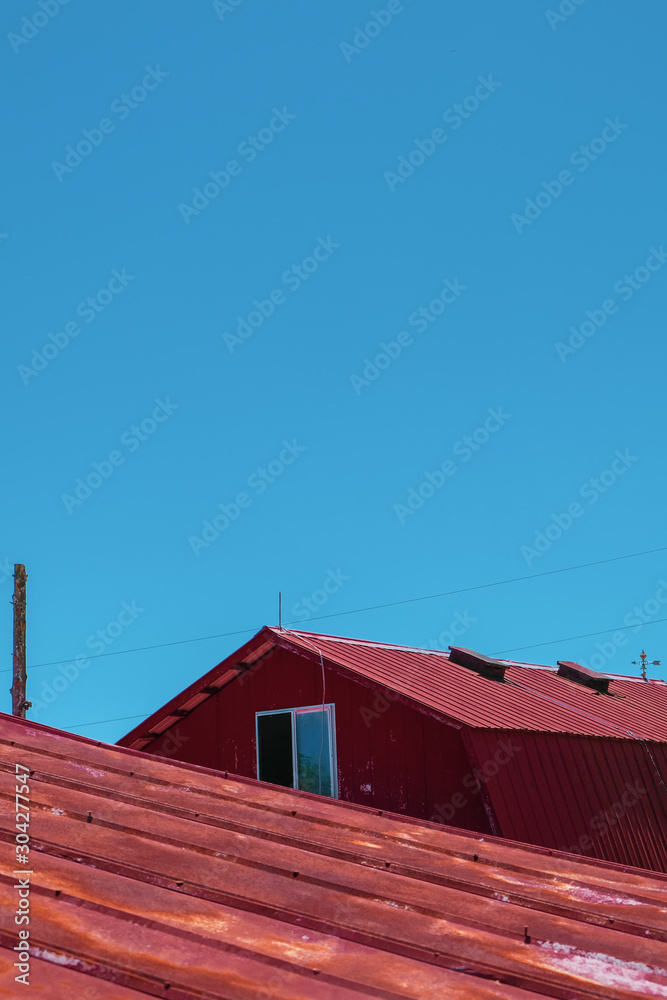 Red barn with blue sky