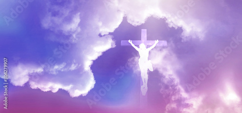 Jesus appeared bright in the sky and Christian Cross with soft fluffy clouds, white and beautiful with the light shining as hope, love and freedom in the sky background. © Ping198