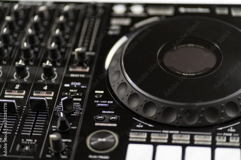 Fototapeta premium Cable to connect professional DJ midi controller to audio mixer.Concert equipment for home party.Disc jockey technology to mix digital music tracks.RCA audio cables