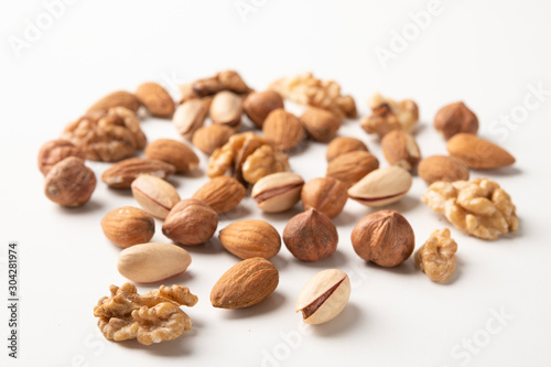 Mixed nuts on a white surface