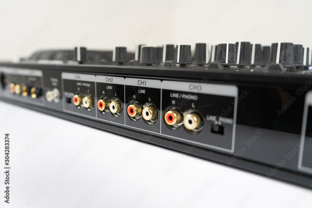 Cable to connect professional DJ midi controller to audio mixer.Concert equipment for home party.Disc jockey technology to mix digital music tracks.RCA audio cables Cable to connect professional DJ midi controller to audio mixer.Concert equipment for home party.Disc jockey technology to mix digital music tracks.RCA audio cables