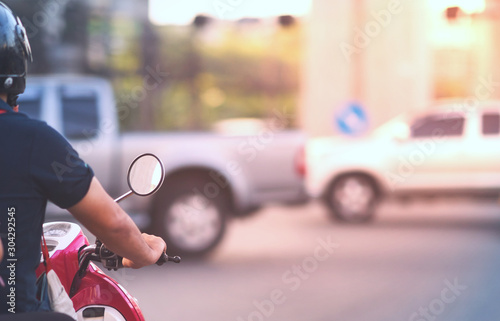 Wallpaper Mural Motorcycle waiting for green light to go to work on crossroad with safty helmet in business success glory concept Torontodigital.ca