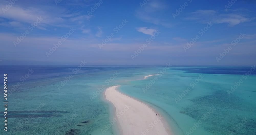 The Beautiful White Sand Island Beach Walkway In The Maldives Surrounded By Cool, Calm And Peaceful Waters - Aerial Shot The Beautiful White Sand Island Beach Walkway In The Maldives Surrounded By Cool, Calm And Peaceful Waters - Aerial Shot
