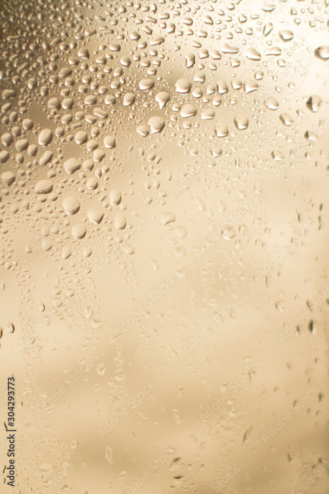 window with rain drops on beige background window with rain drops on beige background