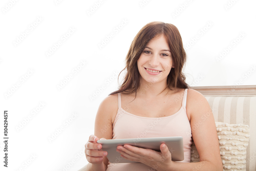 Young female using digital pad or computer on white background Young female using digital pad or computer on white background
