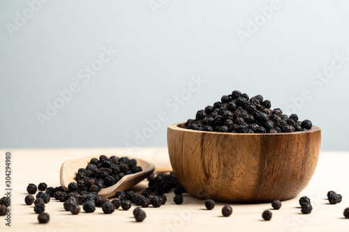 Fresh black cambodian pepper corn in bowl, cooking preparation