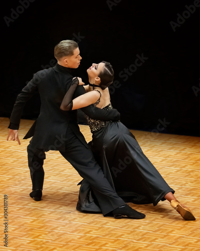 A elegant ballroom couple strikes a pose