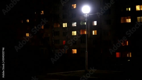 Wallpaper Mural Lamp blinks in the night city. Electricity problems. Old lamp on the street in a dark city. Scary street Torontodigital.ca