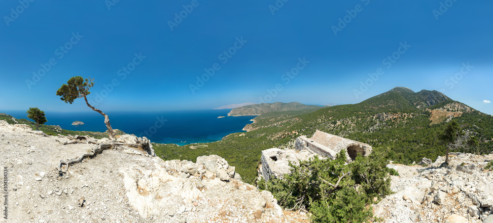 Panorama of the ruins of Monolithos castle built by the Knights of Saint John on the top of isolated craggy rock, Rhodes, Dodecanese, Greece