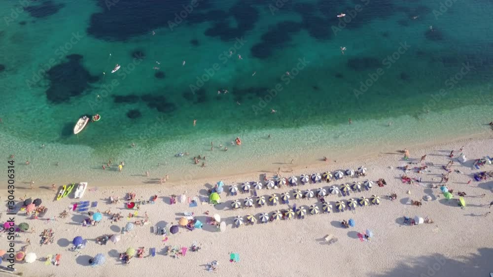 Scenic sea inlet with white sand beach, tilt down aerial Scenic sea inlet with white sand beach, tilt down aerial