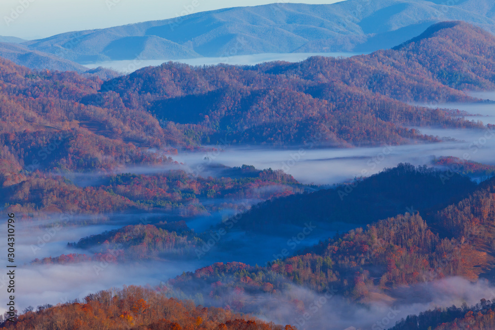 Impressive sea of clouds at sunrise, in the Appalachian Mountains, on a beautiful autumn day