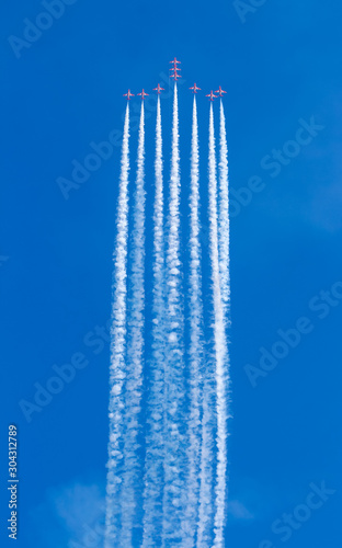 Jet plane flying in blue sky wiht Colorful smoke.Aerospace exhibition at airshow in Zhuhai  Guangdong Province of China.