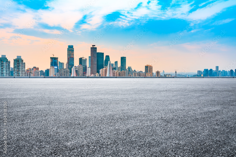 Fototapeta premium Sunset empty asphalt road and city skyline in Chongqing