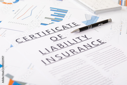 certificate of liability insurance concept , documents on the desktop
