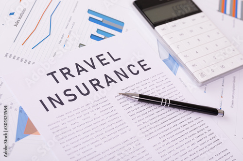 travel insurance concept, documents on the desktop