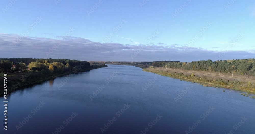 Wild environment panorama of rural with houses and gardens on a river surrounded by background sky and clouds with stunning landscape cinematic views. Concept climate outdoor nature. Wild environment panorama of rural with houses and gardens on a river surrounded by background sky and clouds with stunning landscape cinematic views. Concept climate outdoor nature.