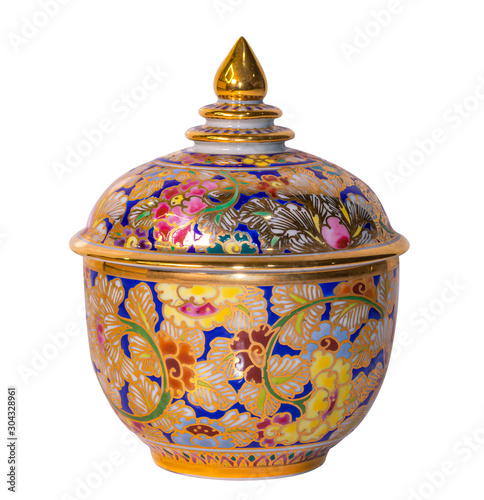 Thai porcelain benjarong traditional ceramic jar with lid. Benjarong ware is a kind of painted Thai ceramics porcelain, isolated on white with clipping path photo