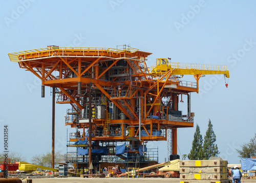 Offshore oil rig platform during construction site in the harbor yard.