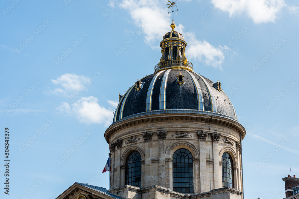 Dome of The Institut de France at the bank of Seine River, Paris. A French learned society, grouping five academies, the most famous of which is the Academie francaise