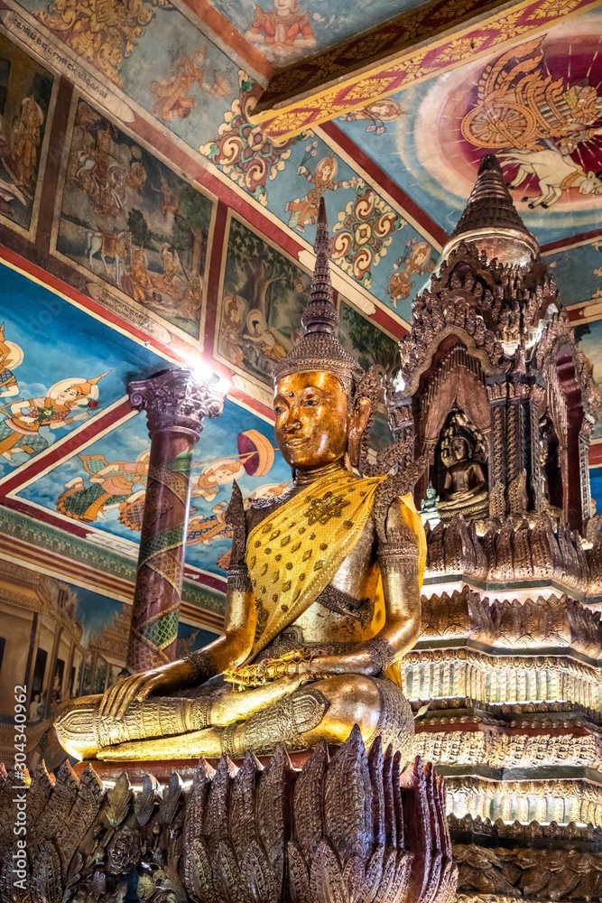  Buddha statue inside Wat Phnom, Phnom Penh, Cambodia