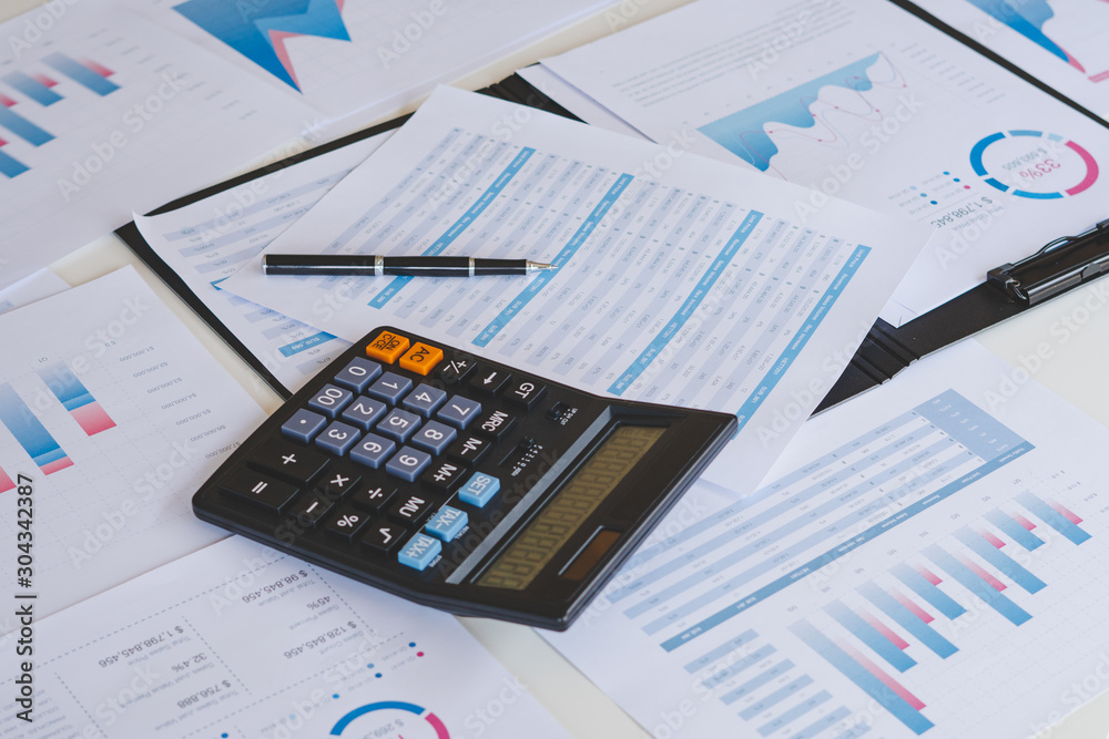 businessman working calculate data document graph chart report marketing research development planning management strategy analysis financial accounting. Business office concept. businessman working calculate data document graph chart report marketing research development planning management strategy analysis financial accounting. Business office concept.
