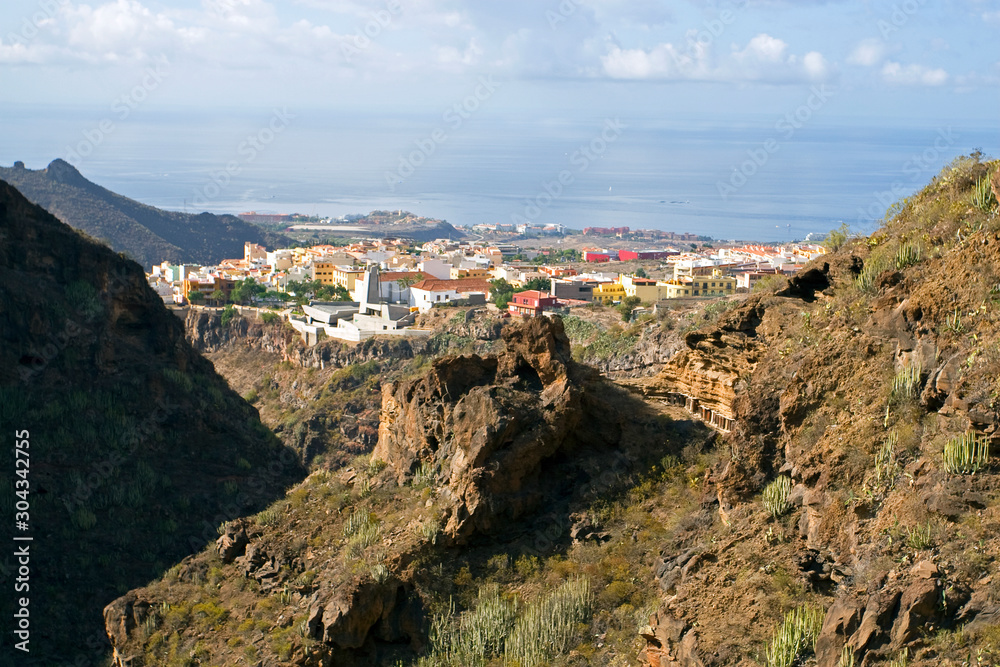 panorama of a small Spanish city in Tenerife from above near the sea, natural background