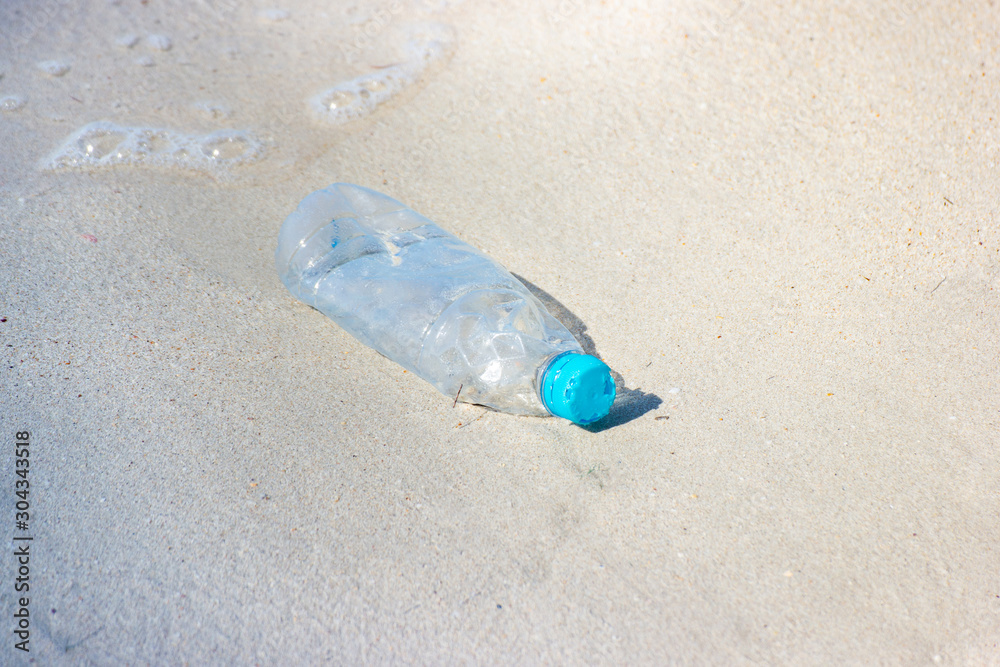 garbage and plastic bottles and dirty waste on a beach, Concept Campaign to stop using plastic bottles