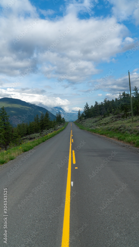 road to the mountains in the distance road to the mountains in the distance