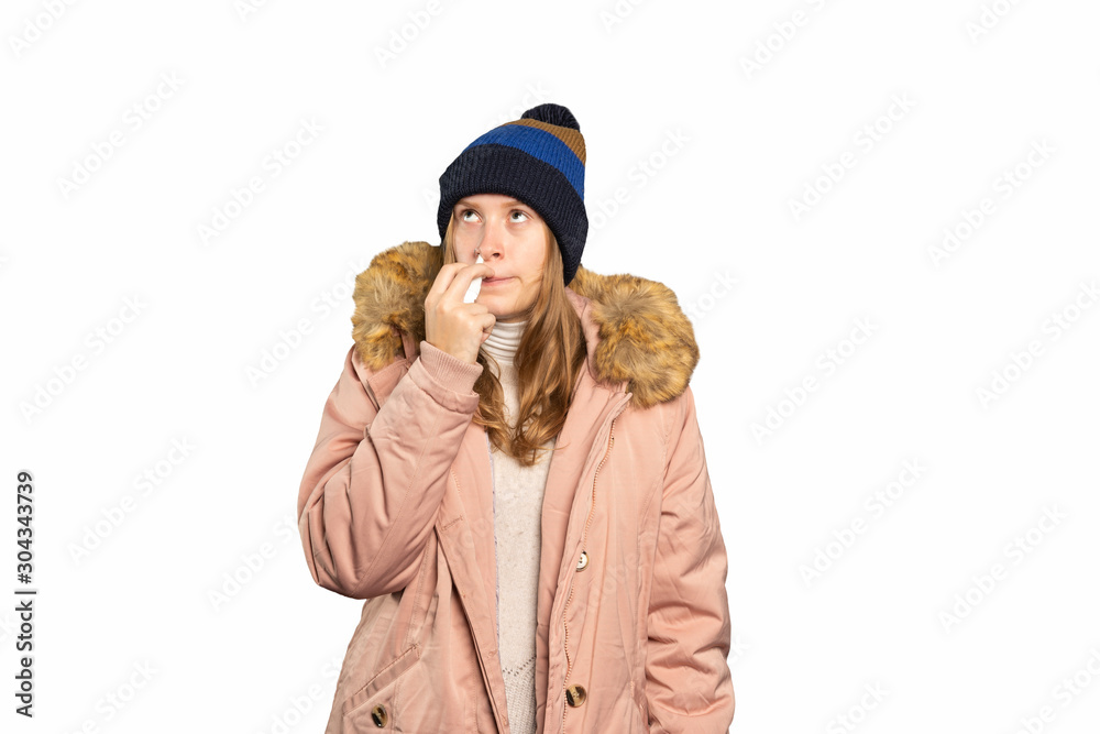 young woman is ill and takes a nasal spray young woman is ill and takes a nasal spray