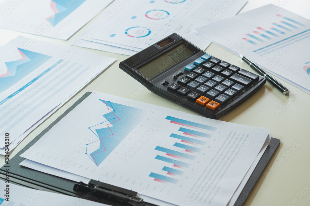 businessman working calculate data document graph chart report marketing research development planning management strategy analysis financial accounting. Business office concept. businessman working calculate data document graph chart report marketing research development planning management strategy analysis financial accounting. Business office concept.