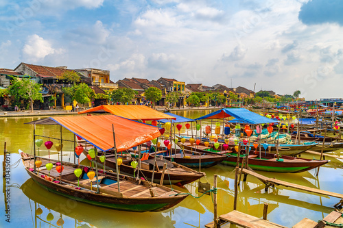 Wooden boats on the Thu Bon River in Hoi An , Vietnam photo