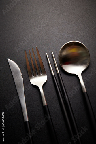 Table eating utensil on black background 