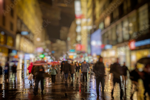 Photography Crowd of anonymous people walking on busy night streets