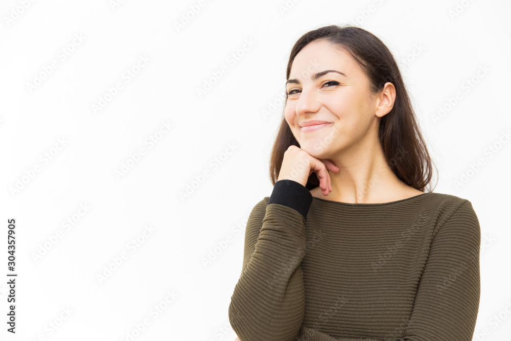 Joyful confident Latin woman looking at camera, touching chin, smiling. Young woman in casual standing isolated over white background. Happy woman portrait concept Joyful confident Latin woman looking at camera, touching chin, smiling. Young woman in casual standing isolated over white background. Happy woman portrait concept